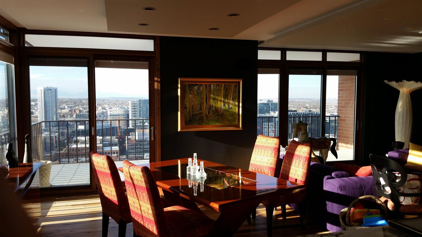 Freshly painted high-rise dining room with a city view, by Rock's Finest Finishes