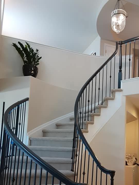 Painted curved staircase by Rock's Finest Finishes